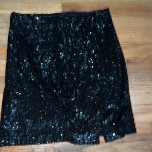 Black sparkly skirt, slit, zipper on side